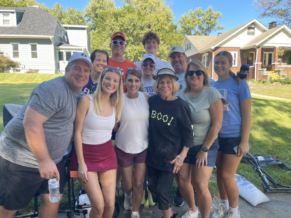 A group of neighbors smiling together at Harvest Hoedown